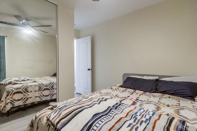3454 Castle Glen Dr Unit 115, San Diego, CA 92123 - bedroom featuring wood finished floors, ceiling fan, and a closet