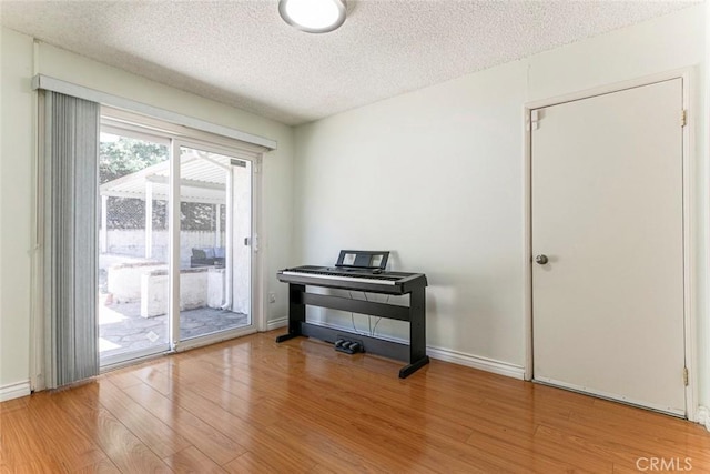 10919 Terecita Rd, Tujunga, CA 91042 - living area featuring a textured ceiling and wood finished floors