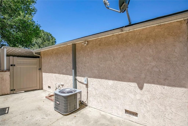 10919 Terecita Rd, Tujunga, CA 91042 - exterior view of stucco siding and a central AC unit