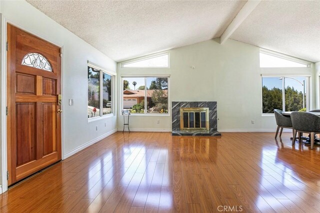 10919 Terecita Rd, Tujunga, CA 91042 - living room with a textured ceiling, wood finished floors, and a high end fireplace