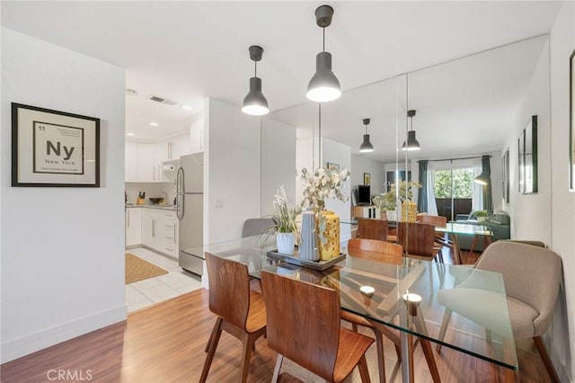2825 N Los Felices Rd Unit 211, Palm Springs, CA 92262 - dining room featuring light wood finished floors and baseboards