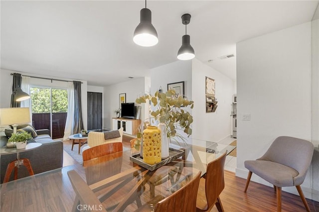 2825 N Los Felices Rd Unit 211, Palm Springs, CA 92262 - dining space with light wood-style flooring