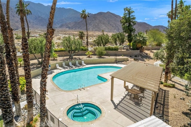 2825 N Los Felices Rd Unit 211, Palm Springs, CA 92262 - community pool with a mountain view, a patio area, and a hot tub
