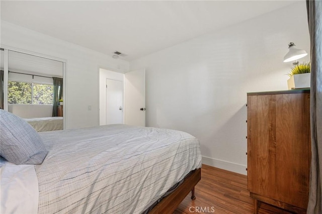 2825 N Los Felices Rd Unit 211, Palm Springs, CA 92262 - bedroom with baseboards and wood finished floors