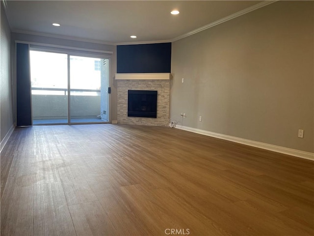 21520 Burbank Blvd Unit 116, Woodland Hills, CA 91367 - unfurnished living room with wood finished floors, crown molding, a stone fireplace, and recessed lighting