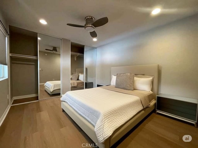 21520 Burbank Blvd Unit 116, Woodland Hills, CA 91367 - bedroom featuring multiple closets, wood finished floors, ceiling fan, and recessed lighting