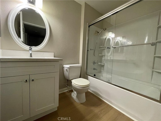 21520 Burbank Blvd Unit 116, Woodland Hills, CA 91367 - full bath featuring wood finished floors, vanity, combined bath / shower with glass door, and a textured wall
