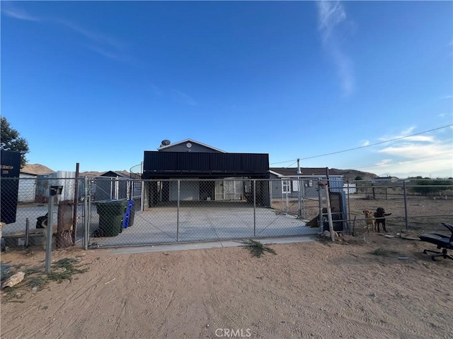24675 Via Vista Rd, Apple Valley, CA 92307 - back of property featuring a gate and driveway