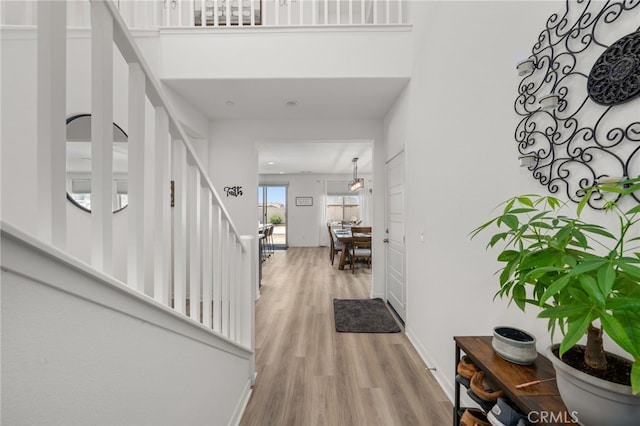 5756 Quicksilver Way, Banning, CA 92220 - entryway with light wood finished floors and stairway