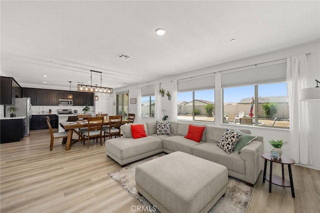 5756 Quicksilver Way, Banning, CA 92220 - living room featuring light wood-style floors and recessed lighting