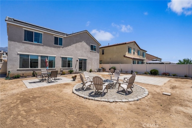 5756 Quicksilver Way, Banning, CA 92220 - back of property featuring an outdoor fire pit, a patio, and stucco siding