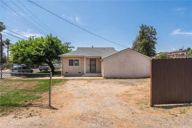 5609 Beach St, Jurupa Valley, CA 92509 - view of front of property with stucco siding and a shingled roof