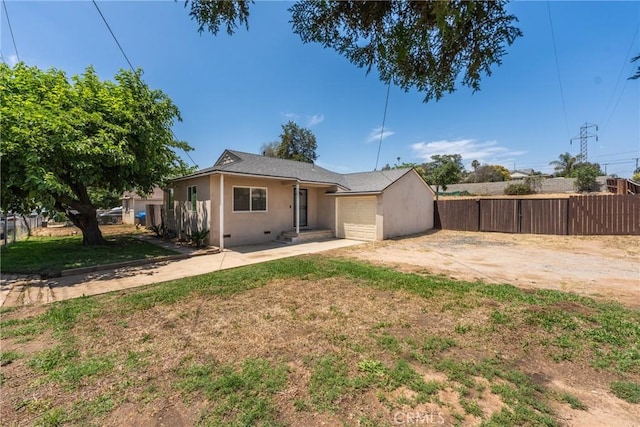 5609 Beach St, Jurupa Valley, CA 92509 - back of property featuring a garage and stucco siding