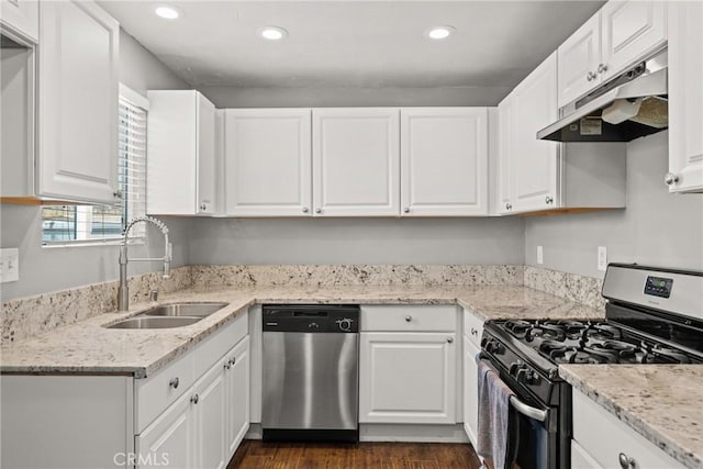 5609 Beach St, Jurupa Valley, CA 92509 - kitchen with appliances with stainless steel finishes, under cabinet range hood, white cabinetry, recessed lighting, and dark wood-style flooring