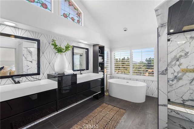 1213 Via Visalia, San Clemente, CA 92672 - bathroom with vanity, a soaking tub, healthy amount of natural light, a marble finish shower, and high vaulted ceiling