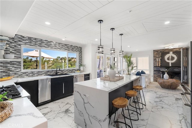 1213 Via Visalia, San Clemente, CA 92672 - kitchen with dark cabinets, a center island, a breakfast bar, light marble finish floors, and wooden ceiling