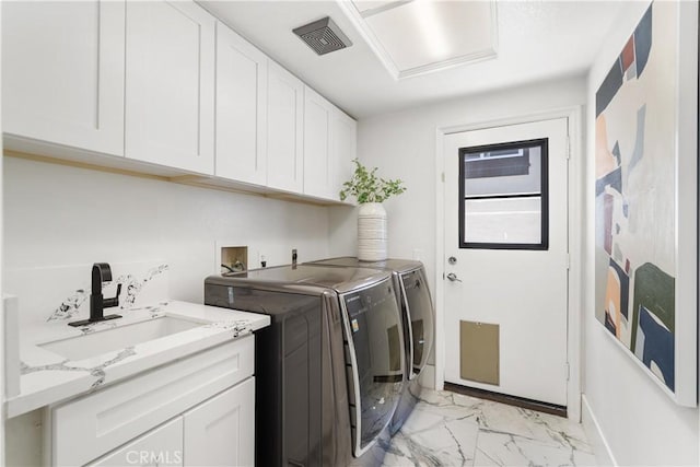 1213 Via Visalia, San Clemente, CA 92672 - laundry room featuring independent washer and dryer, cabinet space, and light marble finish flooring