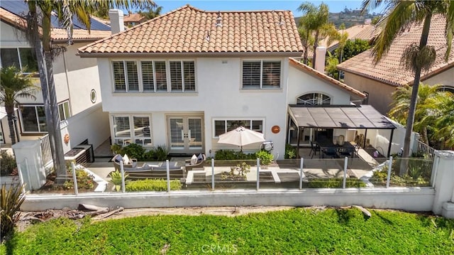 1213 Via Visalia, San Clemente, CA 92672 - back of house featuring stucco siding, french doors, a tile roof, and a patio area