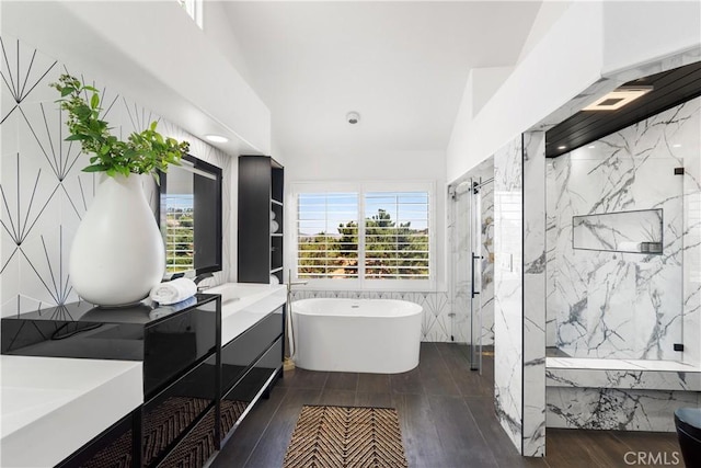 1213 Via Visalia, San Clemente, CA 92672 - bathroom featuring a freestanding tub, a marble finish shower, vanity, wood finished floors, and tile walls
