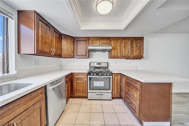 208 N Nicholson Ave Unit B, Monterey Park, CA 91755 - kitchen with appliances with stainless steel finishes, under cabinet range hood, a peninsula, a tray ceiling, and brown cabinets