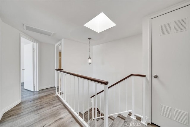 208 N Nicholson Ave Unit B, Monterey Park, CA 91755 - hall featuring an upstairs landing, a skylight, and light wood finished floors