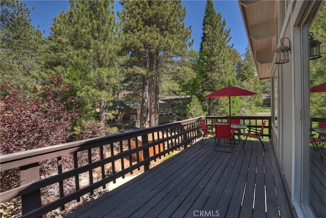 33469 Squirrel Dr, Green Valley Lake, CA 92341 - wooden terrace with outdoor dining area
