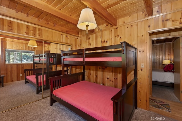 33469 Squirrel Dr, Green Valley Lake, CA 92341 - bedroom with wood walls, a wooden ceiling with exposed beams, and carpet floors