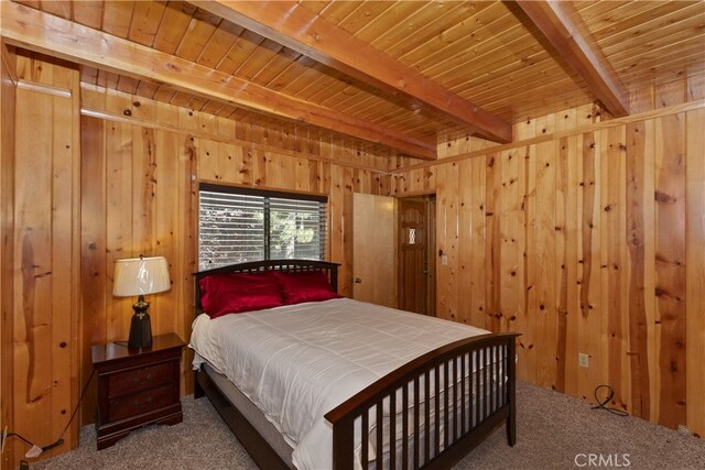 33469 Squirrel Dr, Green Valley Lake, CA 92341 - carpeted bedroom with wood walls and a wooden ceiling with exposed beams
