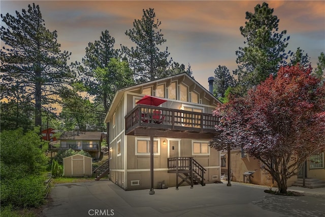 33469 Squirrel Dr, Green Valley Lake, CA 92341 - view of front of home featuring a storage shed and a balcony