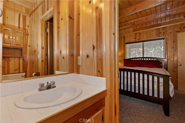 33469 Squirrel Dr, Green Valley Lake, CA 92341 - bathroom featuring a wooden ceiling with exposed beams, wooden walls, and vanity