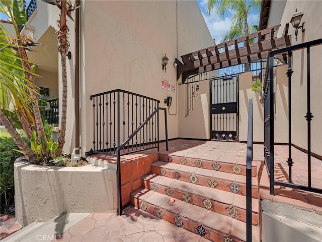 5753 White Oak Ave Unit 3, Encino, CA 91316 - doorway to property featuring stucco siding and a gate