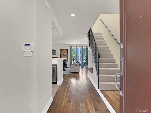 5753 White Oak Ave Unit 3, Encino, CA 91316 - entryway featuring hardwood / wood-style flooring, stairs, a fireplace, and recessed lighting