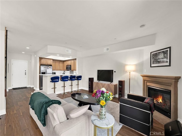 5753 White Oak Ave Unit 3, Encino, CA 91316 - living room with dark wood-style flooring, a glass covered fireplace, and recessed lighting