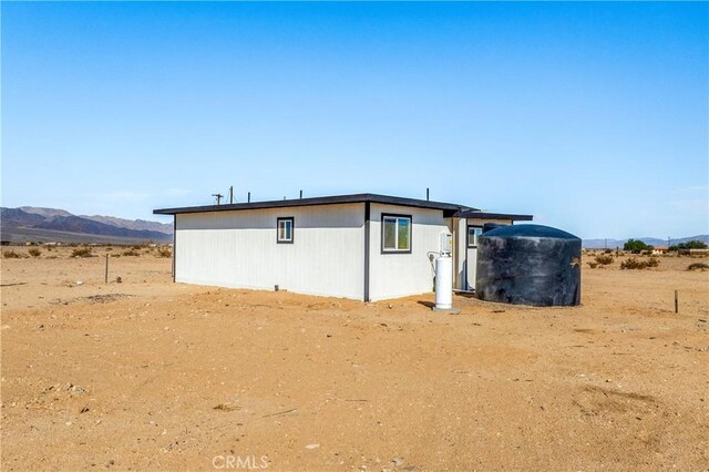 81122 Valle Vista Rd Unit 29, Palms, CA 92277 - rear view of house with a mountain view