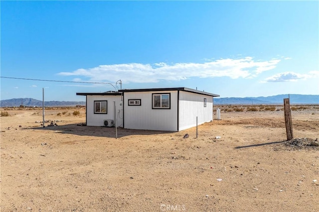 81122 Valle Vista Rd Unit 29, Palms, CA 92277 - view of outbuilding featuring a mountain view, view of desert landscape, and a rural view