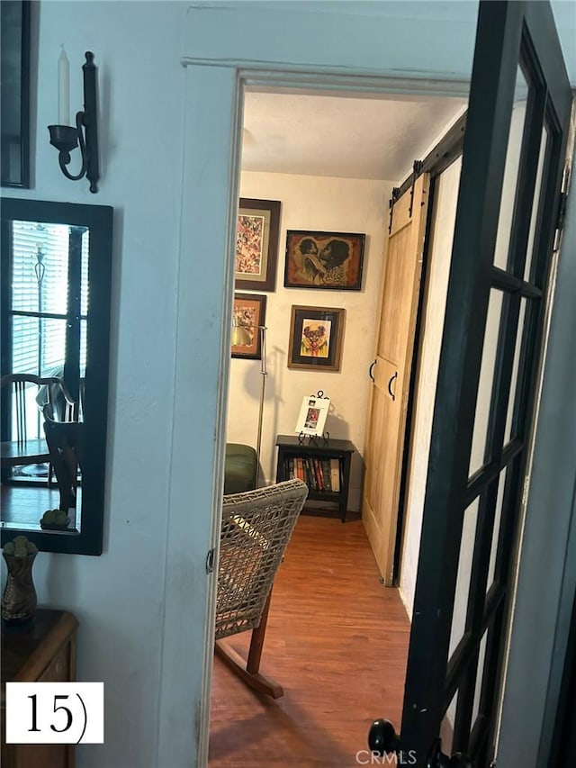 1388 N Lugo Ave, San Bernardino, CA 92404 - hall with wood finished floors and a barn door
