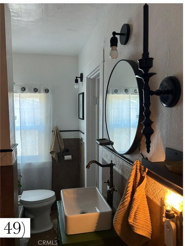 1388 N Lugo Ave, San Bernardino, CA 92404 - bathroom with toilet and a sink