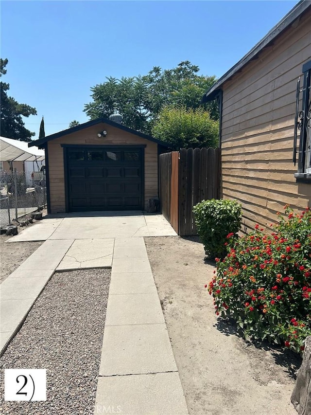1388 N Lugo Ave, San Bernardino, CA 92404 - detached garage featuring concrete driveway