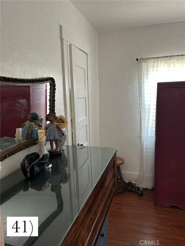 1388 N Lugo Ave, San Bernardino, CA 92404 - hall featuring dark wood-style floors and a textured wall