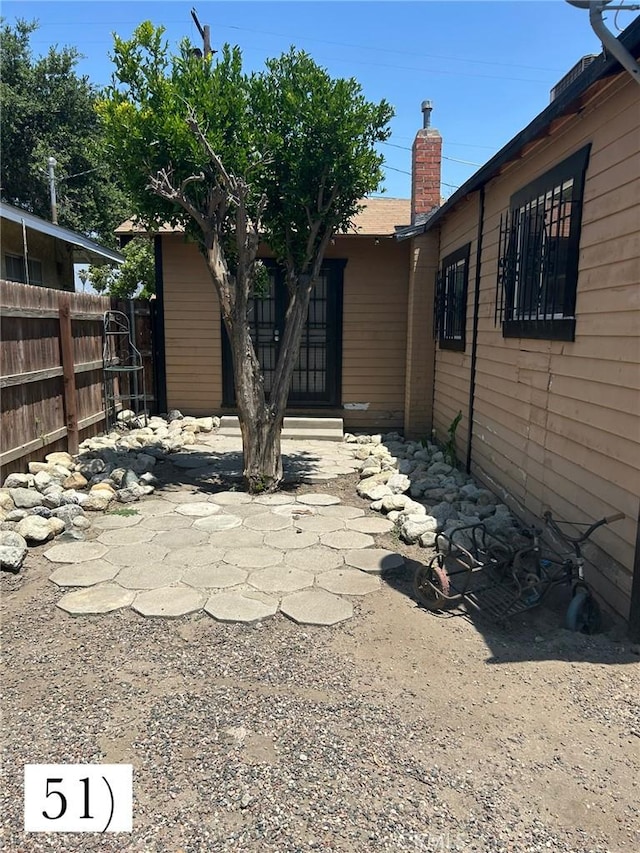 1388 N Lugo Ave, San Bernardino, CA 92404 - back of house with a chimney
