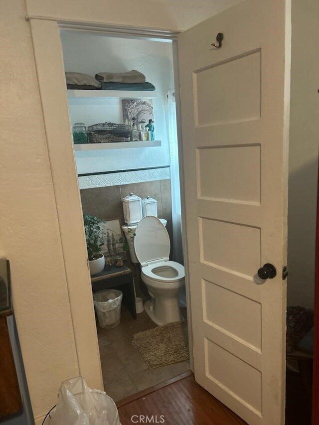 1388 N Lugo Ave, San Bernardino, CA 92404 - bathroom featuring toilet and wood finished floors