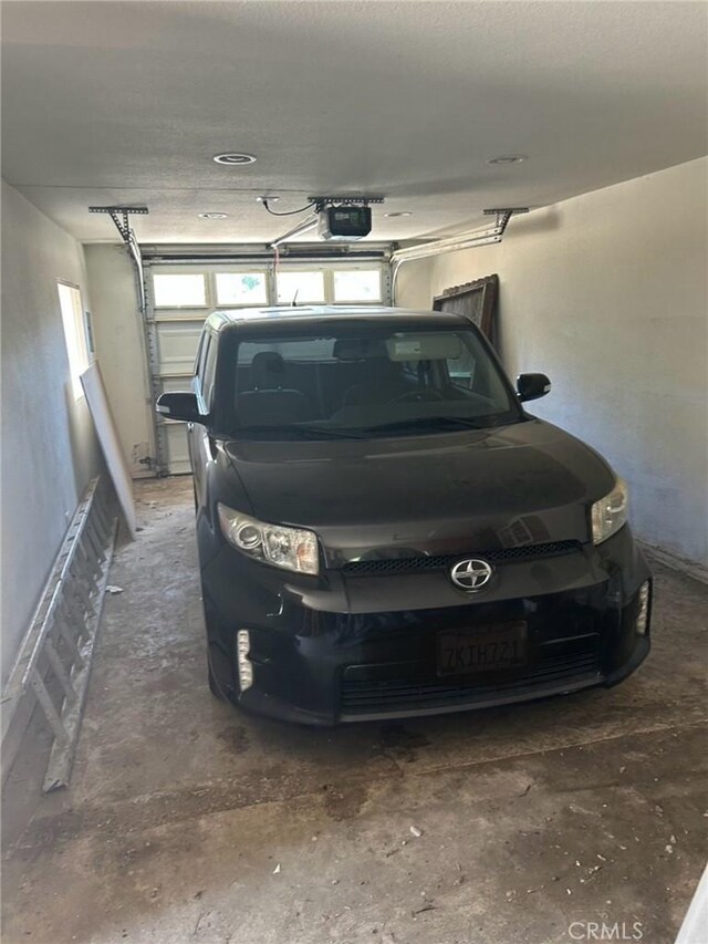 1388 N Lugo Ave, San Bernardino, CA 92404 - garage featuring a garage door opener