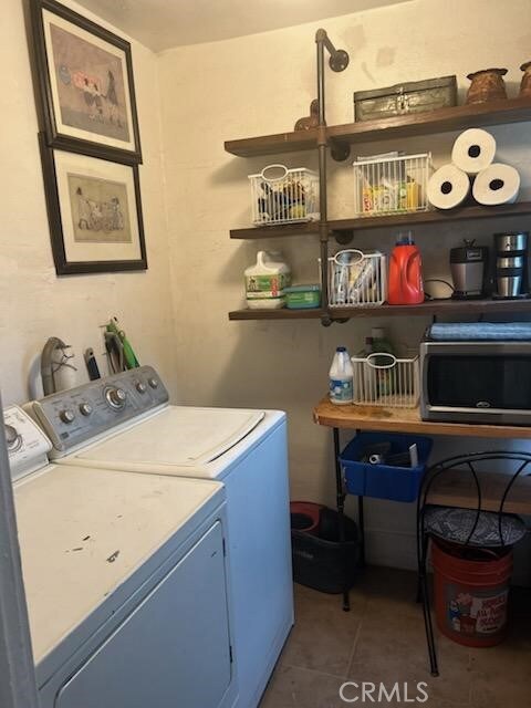 1388 N Lugo Ave, San Bernardino, CA 92404 - laundry room with independent washer and dryer and tile patterned flooring