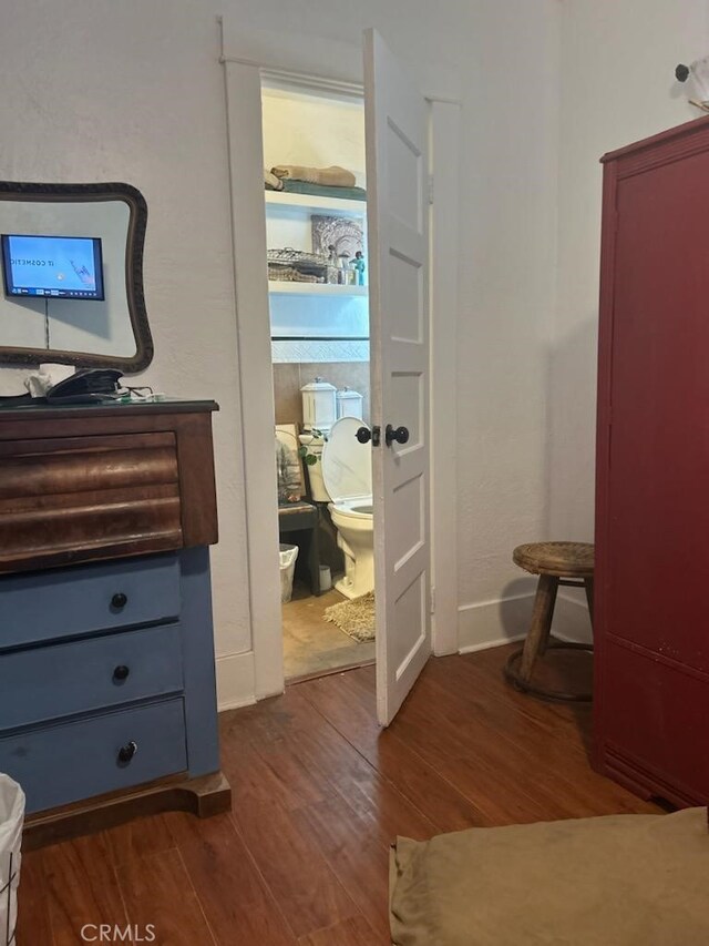 1388 N Lugo Ave, San Bernardino, CA 92404 - hallway featuring dark wood finished floors and baseboards