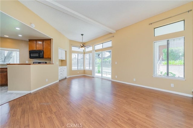 45 Willowcrest Ln, Pomona, CA 91766 - unfurnished living room with light wood-type flooring, healthy amount of natural light, ceiling fan, and beam ceiling