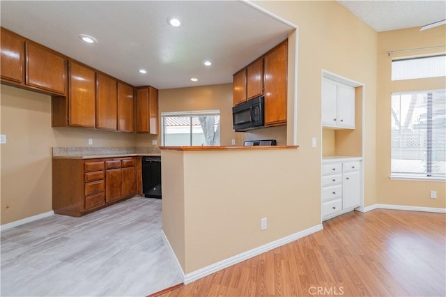 45 Willowcrest Ln, Pomona, CA 91766 - kitchen with black appliances, brown cabinets, light wood-style floors, light countertops, and recessed lighting