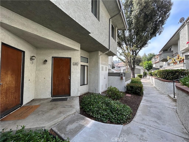 45 Willowcrest Ln, Pomona, CA 91766 - view of exterior entry featuring stucco siding and a residential view
