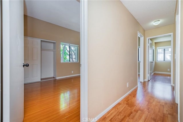 45 Willowcrest Ln, Pomona, CA 91766 - hallway featuring light wood-style flooring and plenty of natural light