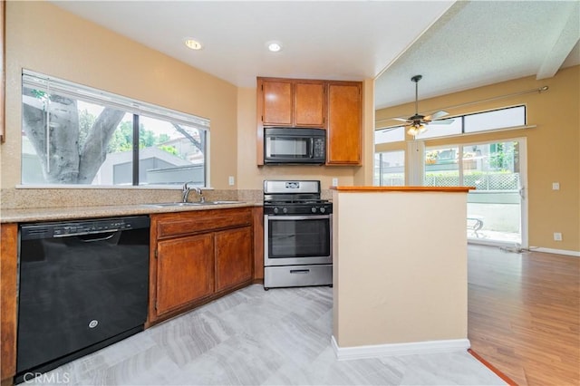 45 Willowcrest Ln, Pomona, CA 91766 - kitchen with black appliances, brown cabinets, healthy amount of natural light, and light countertops