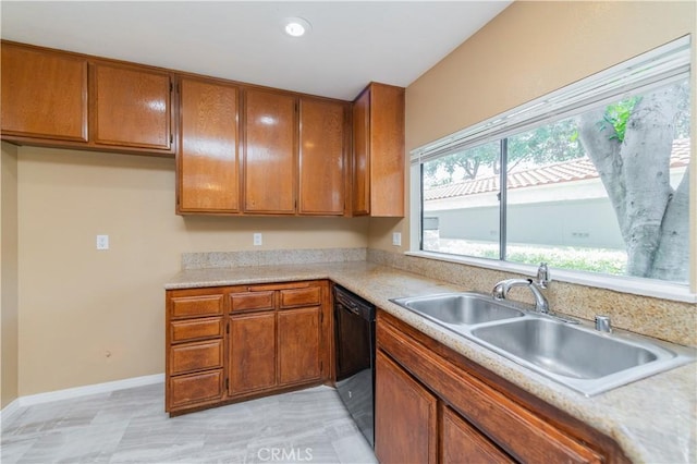 45 Willowcrest Ln, Pomona, CA 91766 - kitchen with dishwasher, brown cabinetry, light countertops, and recessed lighting